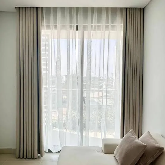 Sheer wave curtains in a Dubai living room